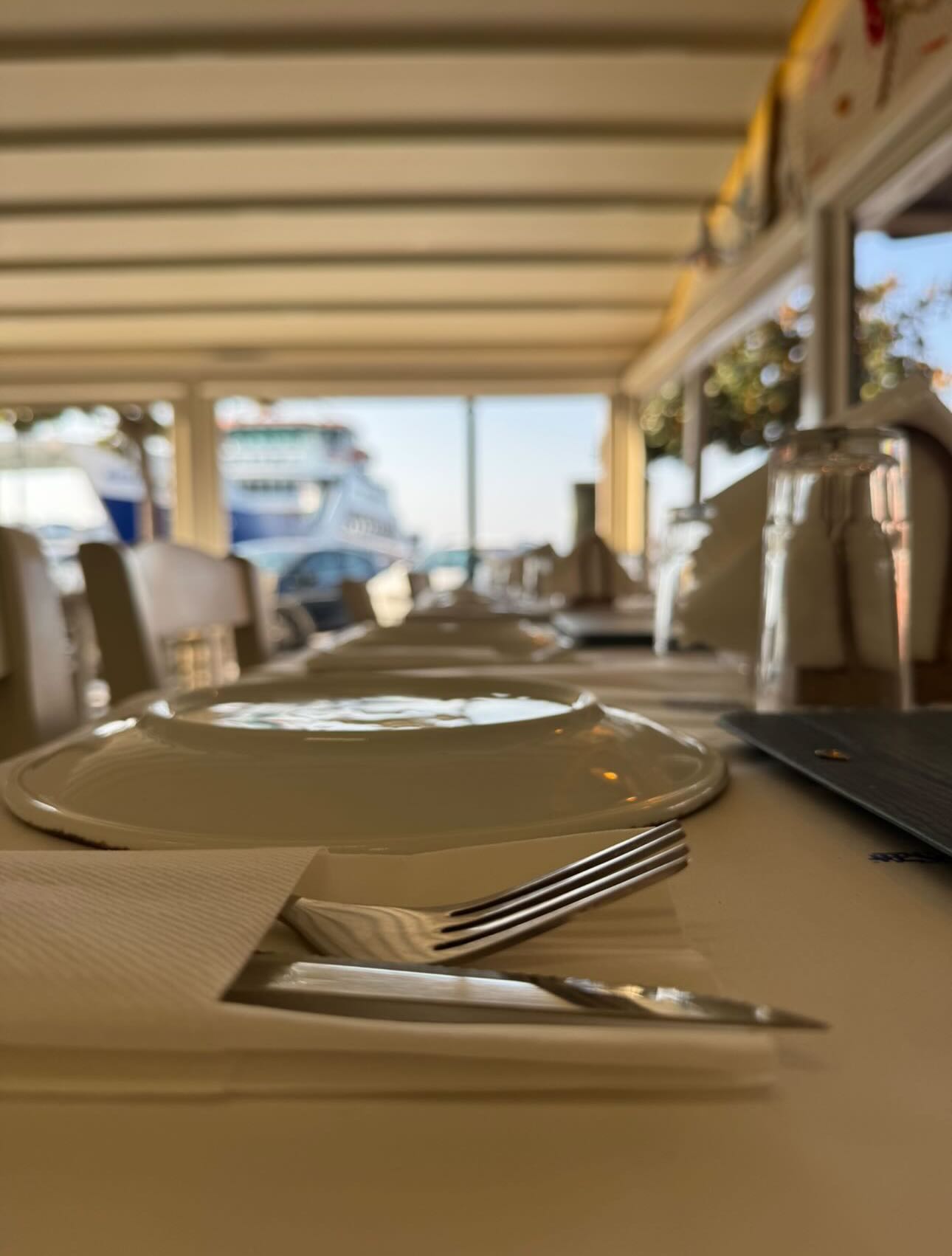 Table set for dinner facing the Limenas harbour